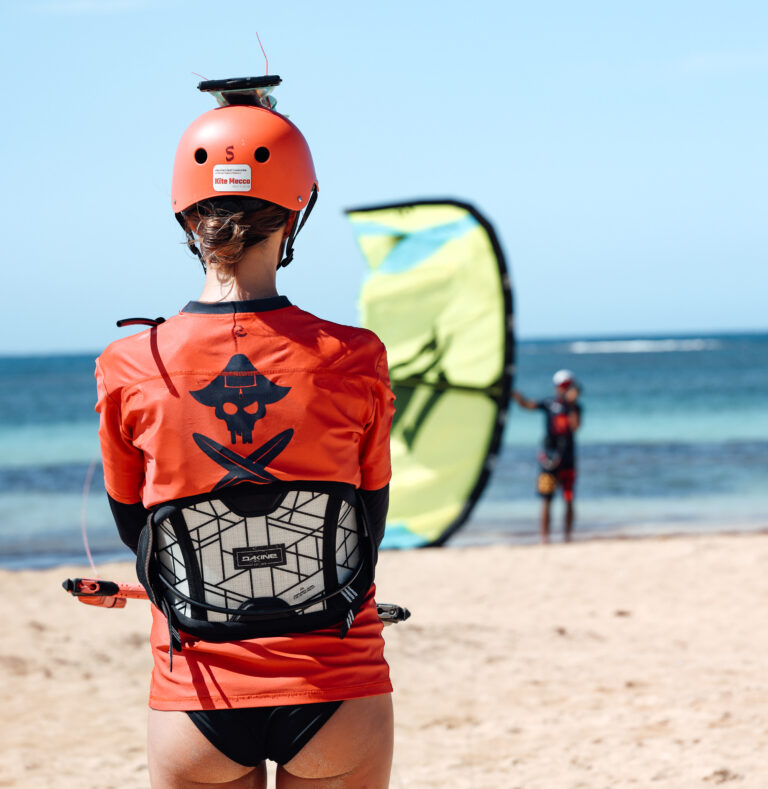 girl learning to kitesurf is practicing launch of the kite